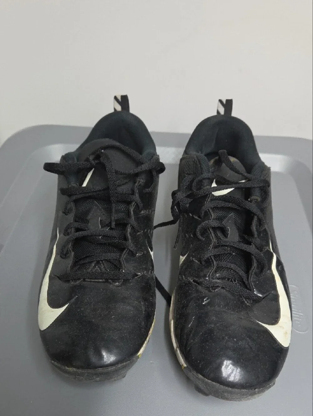 Nike Black and White Youth Athletic Cleats with Yellow Studs